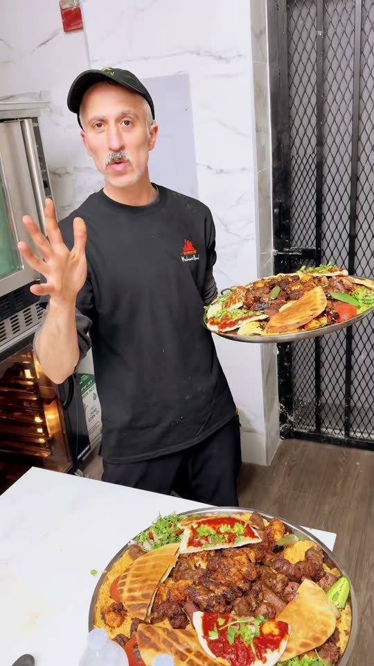 Plated mixed grill with grilled chicken and skewers